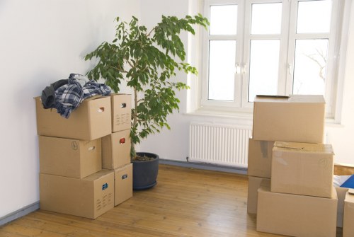Removal team handling furniture during a Bermondsey home move