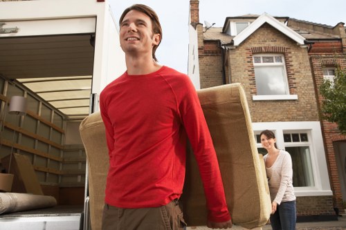 Professional movers packing boxes for a Bermondsey relocation