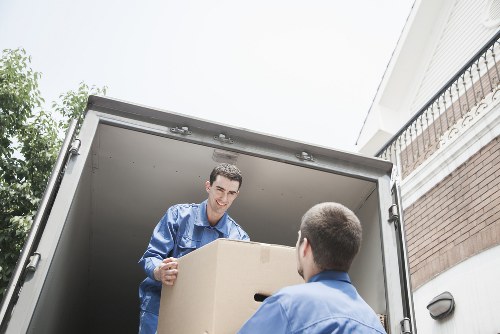 Professional movers loading boxes for a Bermondsey same day removal